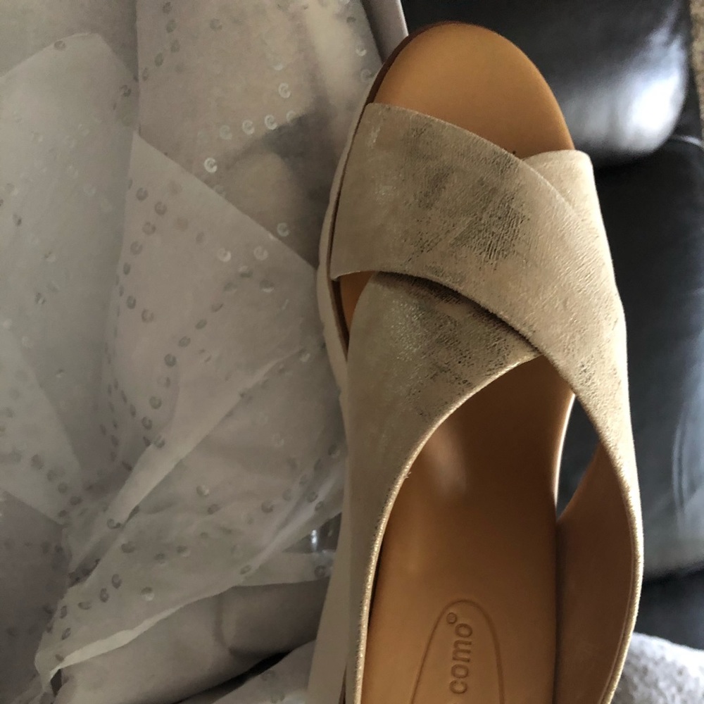 Gold sandal slides like walking on cotton.